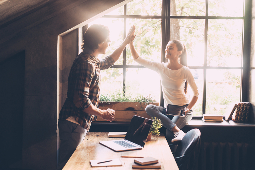 Man High Fiving Woman Romance