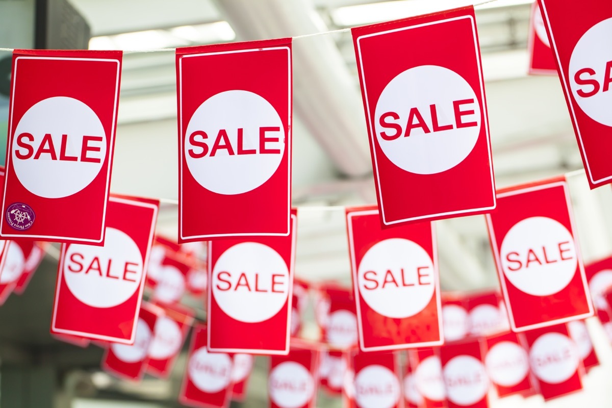 sale flags in store window