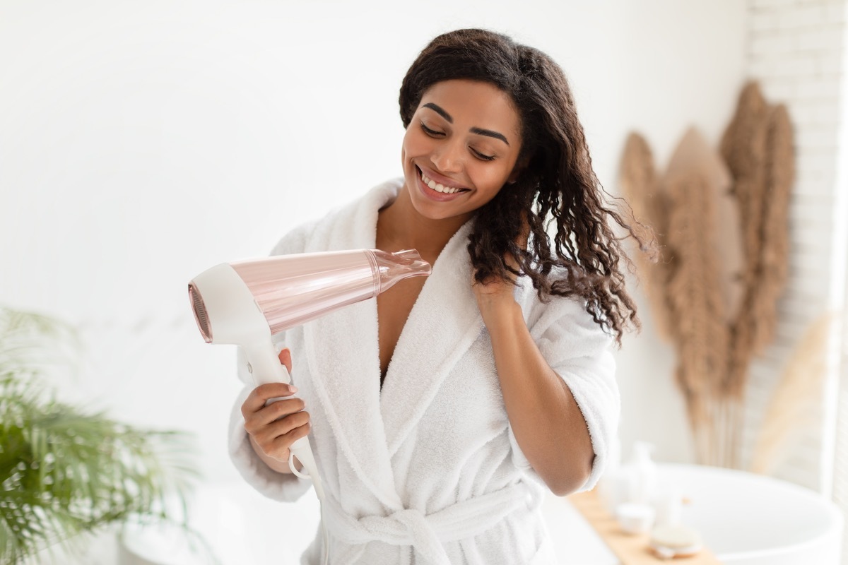 woman drying her hair