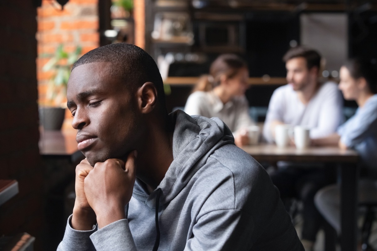 Young Man Isolated from Everyone Else