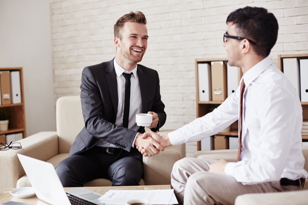 Businessman Shaking Hands Not Ready to Retire