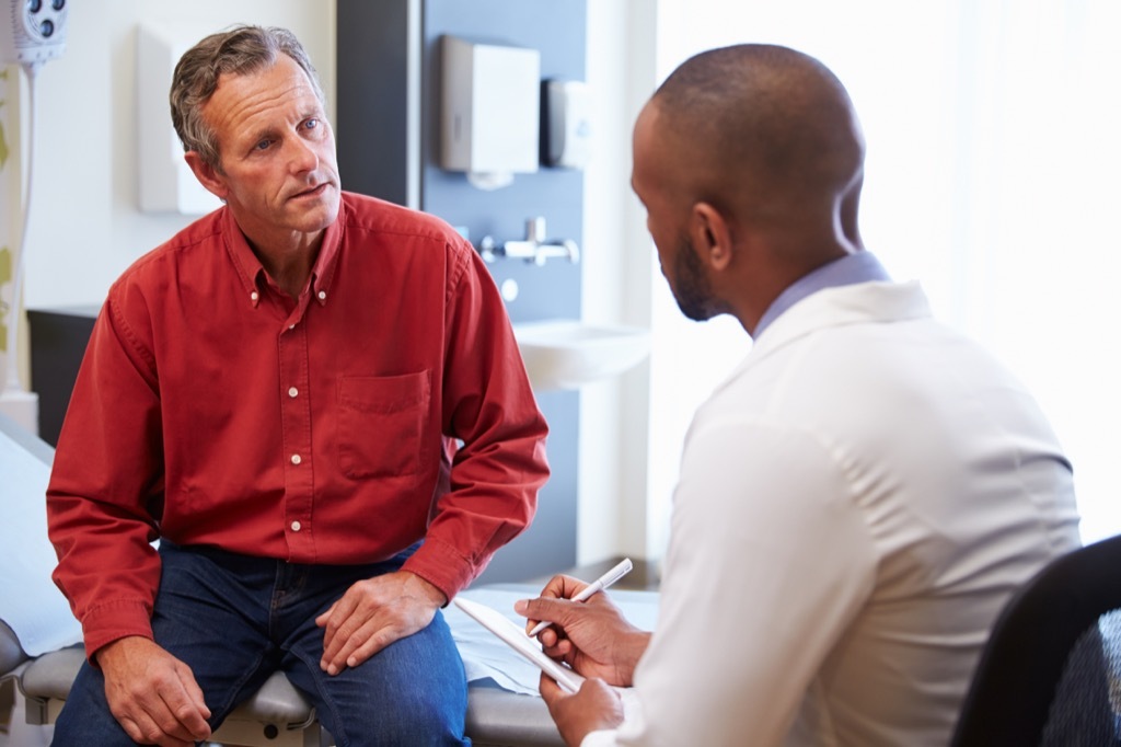 man getting bad news at a doctor checkup