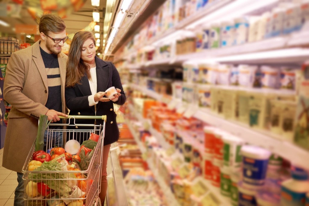 couple in a grocery store shopping aisle