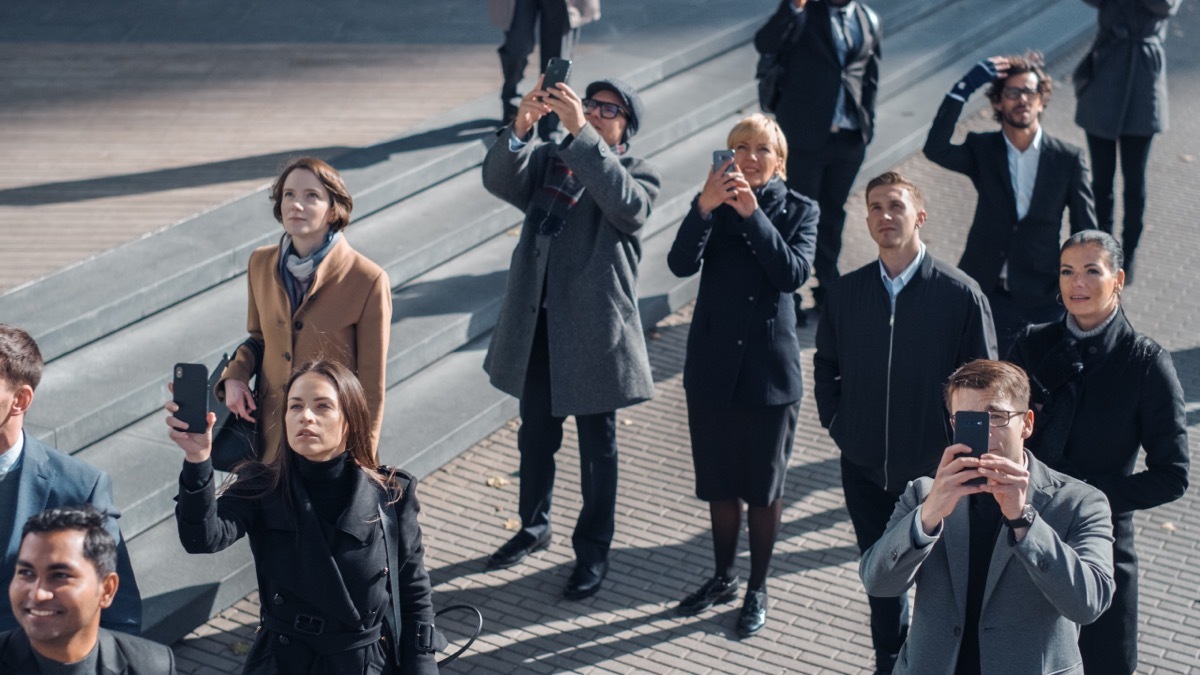 Crowd of People Looking at Something