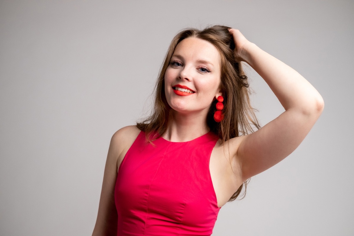 woman wearing watermelon red shirt