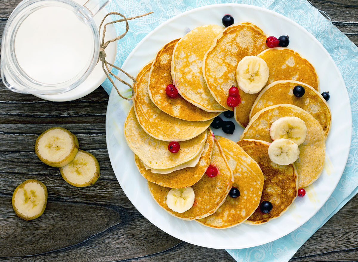 Pancakes on plate with fruit