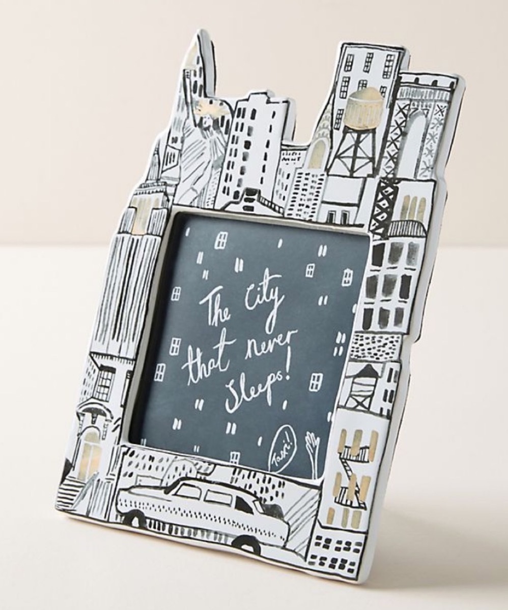 white and black picture frame with nyc skyline