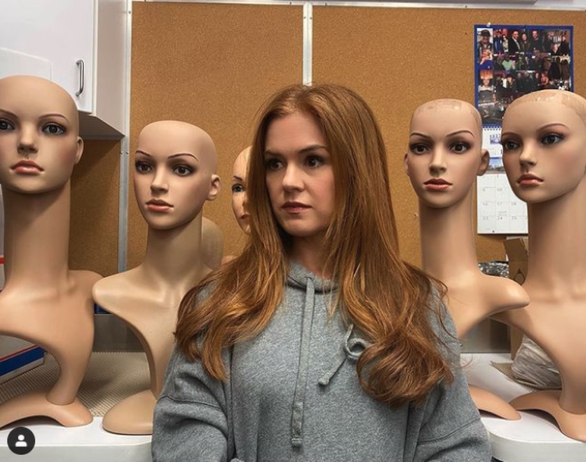 Isla Fisher with mannequin heads