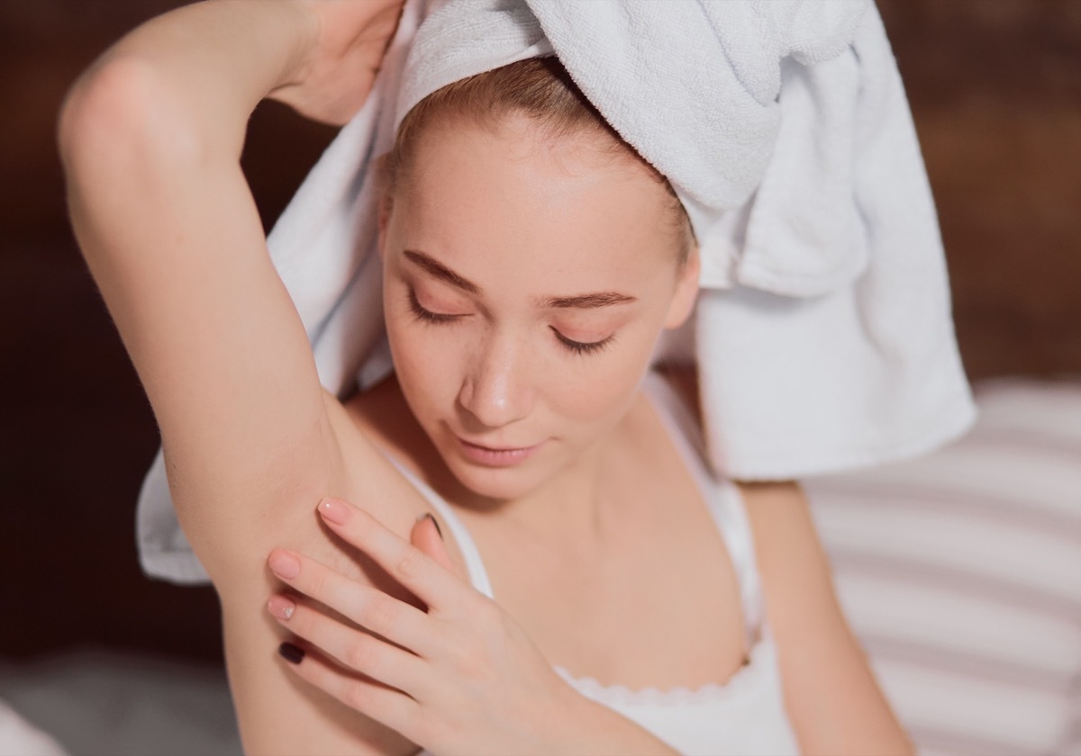 Woman checking her armpit