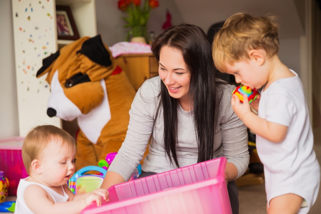 babysitter playing with kids, working mom