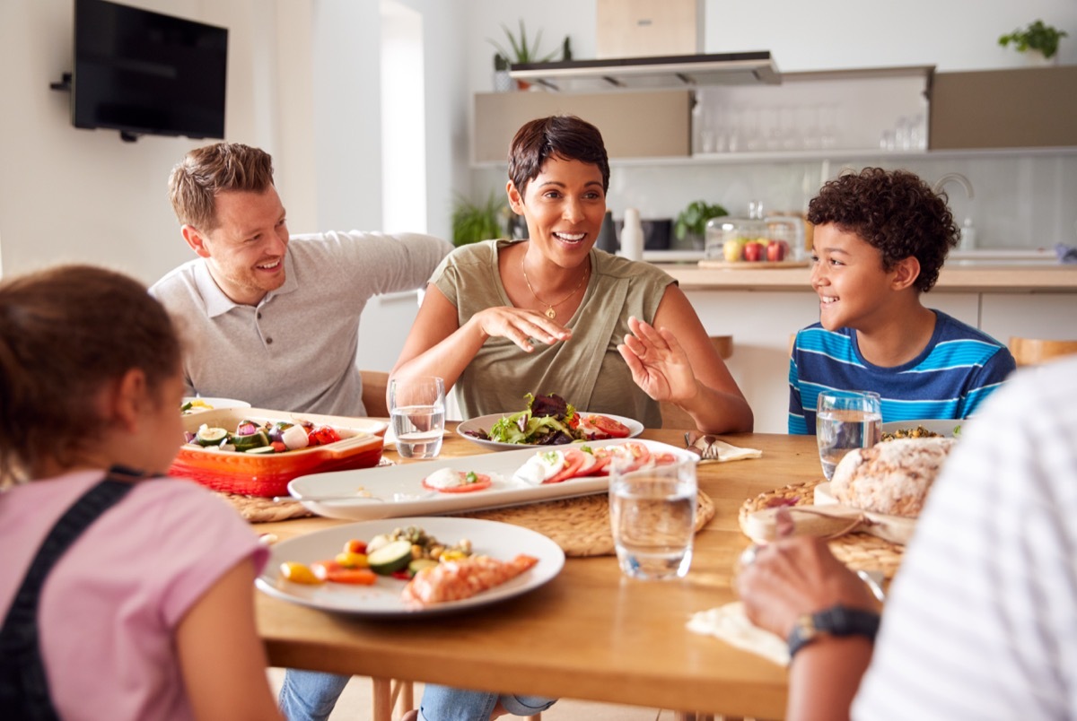 Blended family having dinner