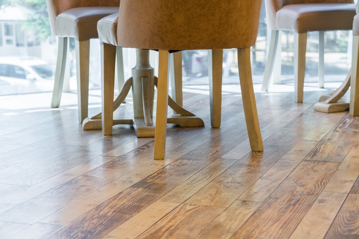 close-up of legs of chairs on the wooden floor