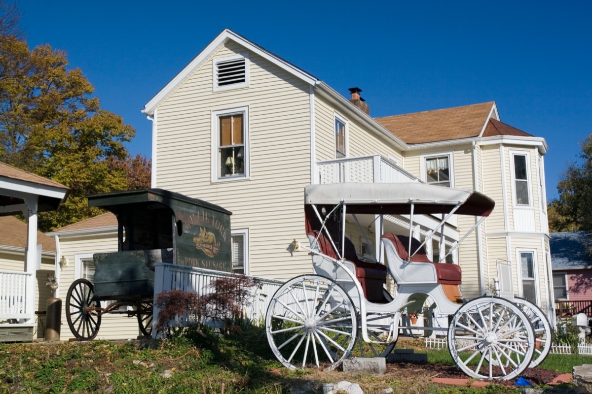 two old buggies sit in a lawn