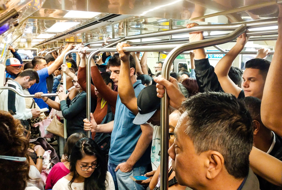 crowded subway car full of people