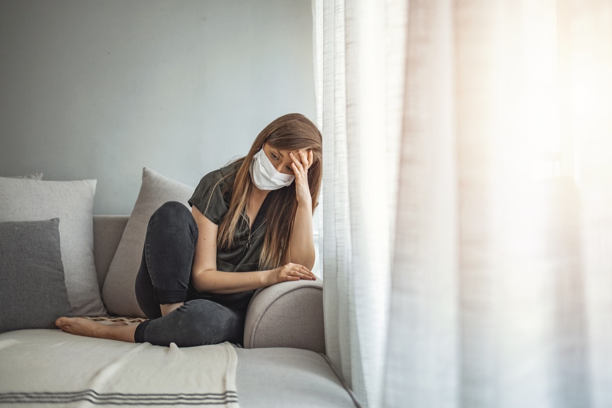 Sad lonely girl isolated stay at home in protective sterile