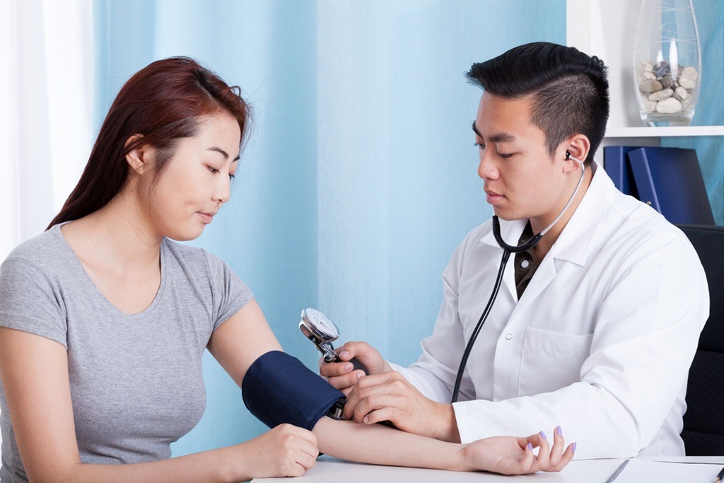 Woman checking her blood pressure