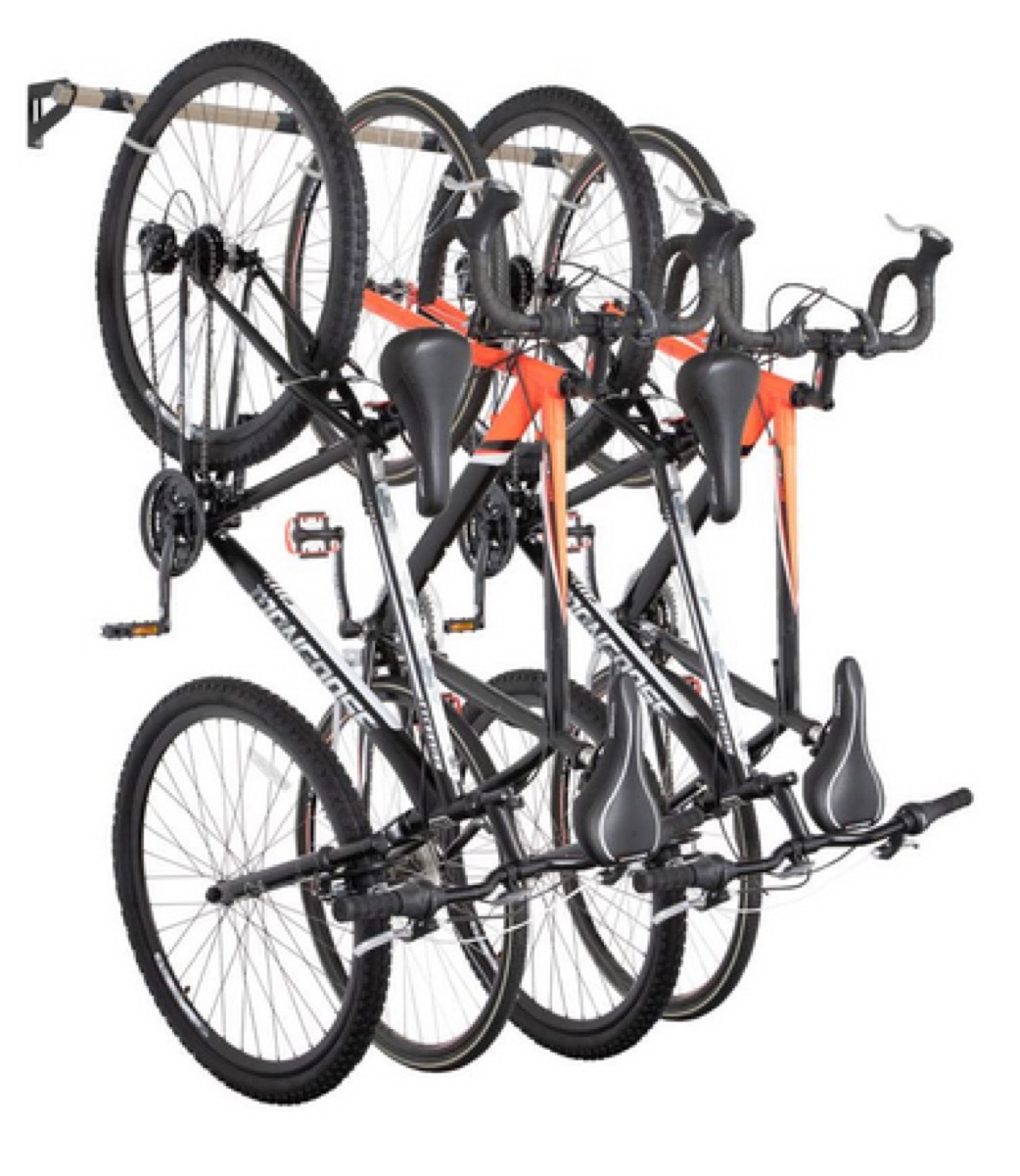 four bikes affixed to wall-mounted bike rack