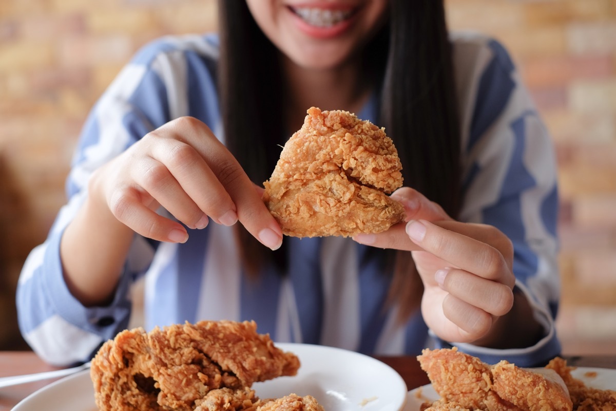 girl eating fried food