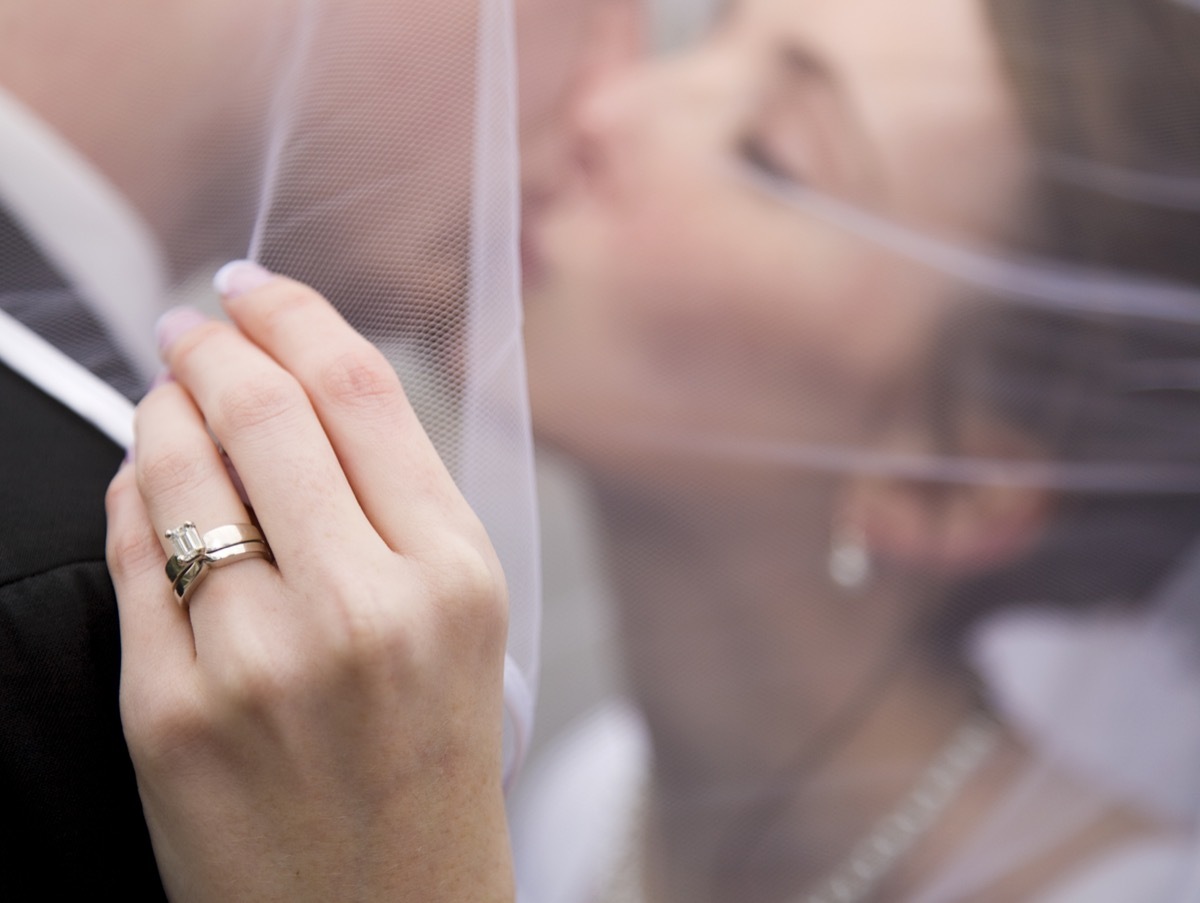 closeup of a bride kissing her new husband