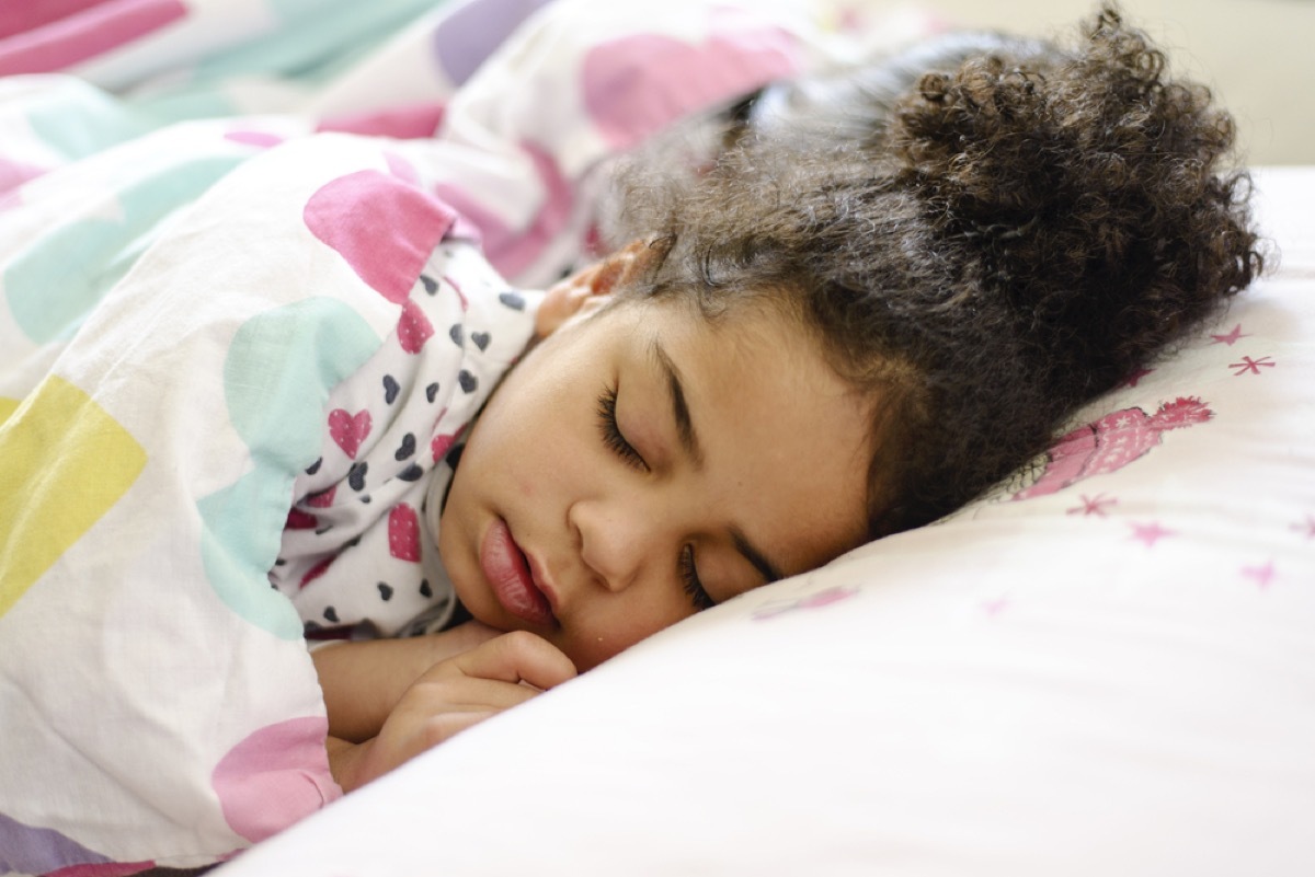 little girl asleep in bed, bad parenting advice