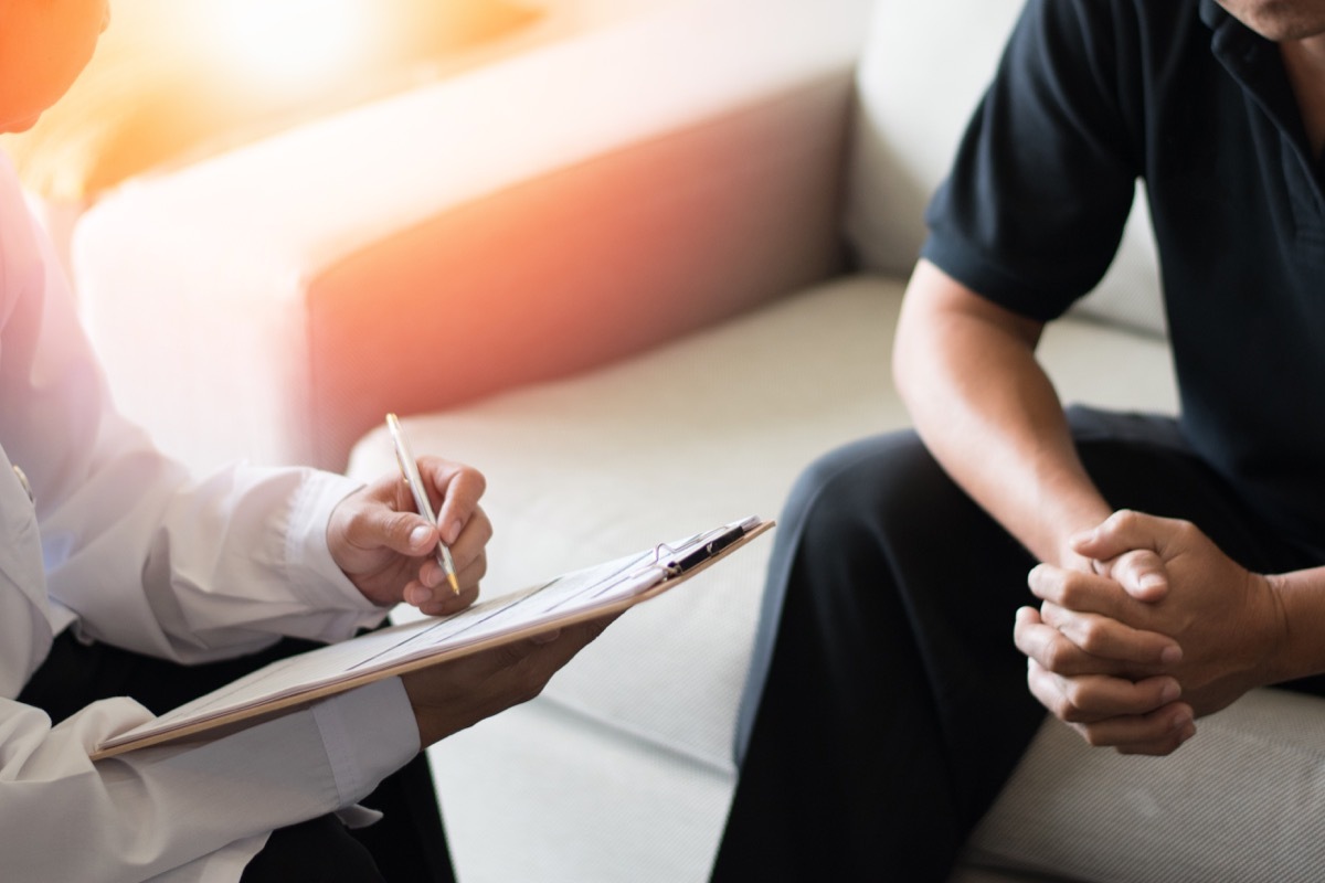 man on couch at doctor's office - male health concerns