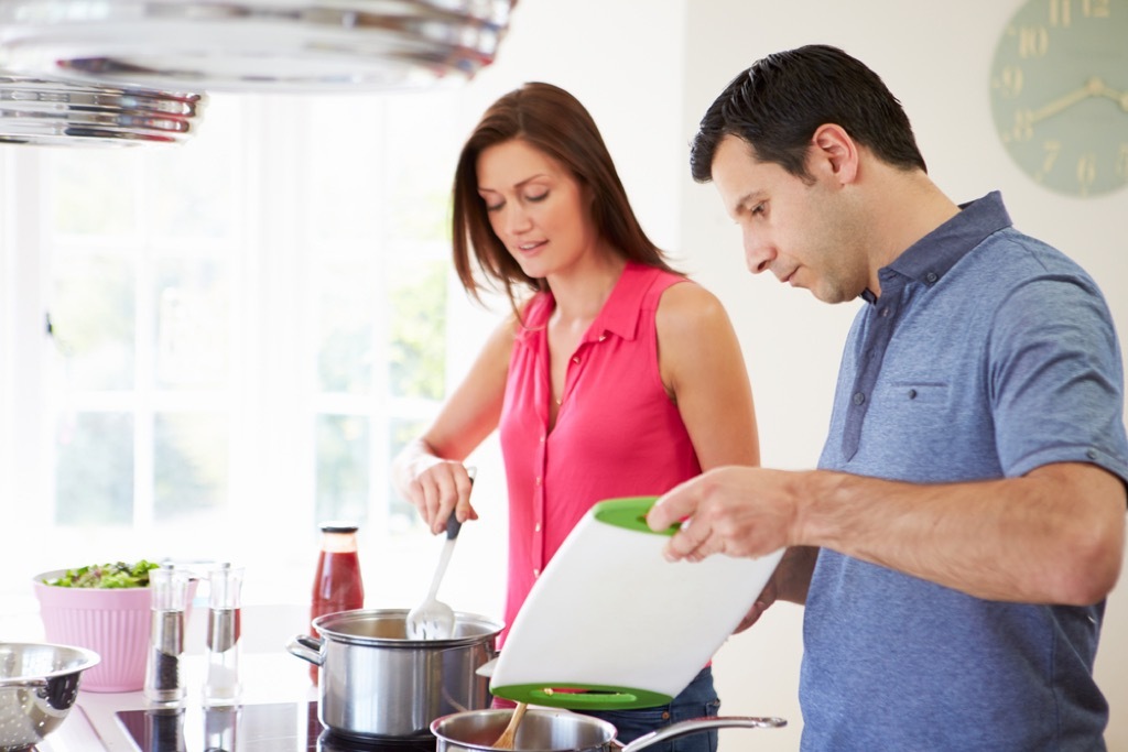 man and woman cooking together husband mistakes