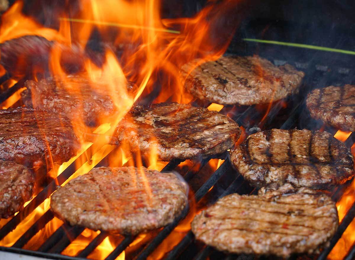 scorching burgers over an open flame