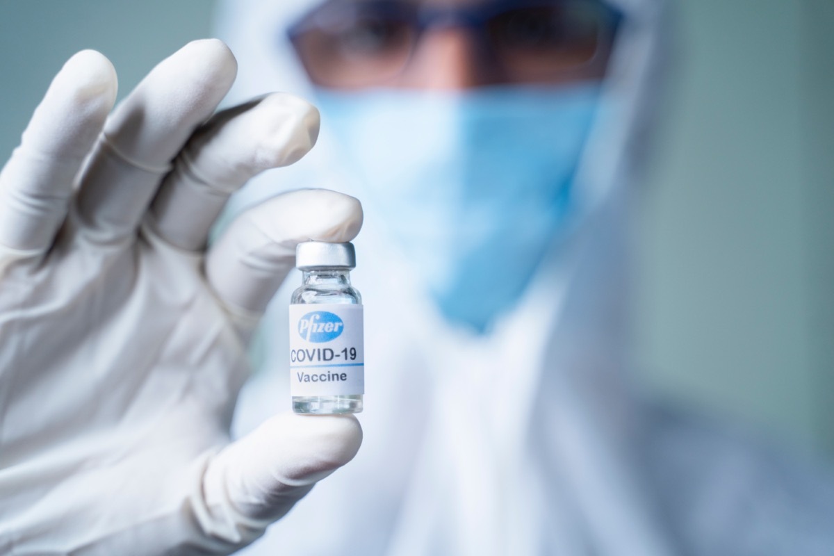 Doctor holding Pfizer Biontech vaccine against coronavirus COVID disease