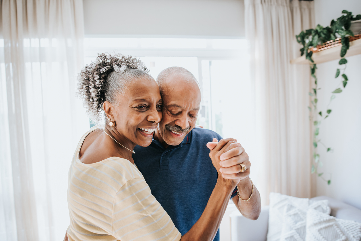 Senior couple dancing together.