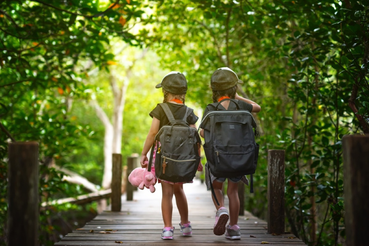 two little girls walking in woods, parenting is harder