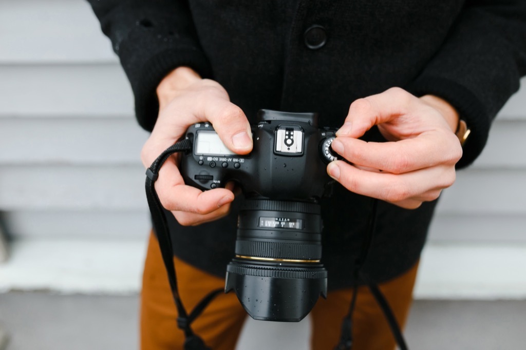 Photographer loads camera