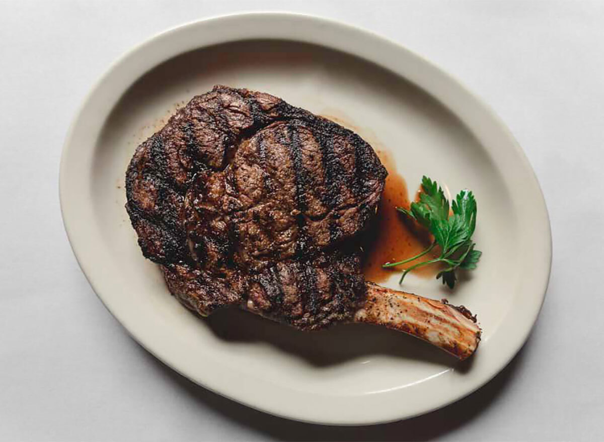 plated tomahawk steak with garnish