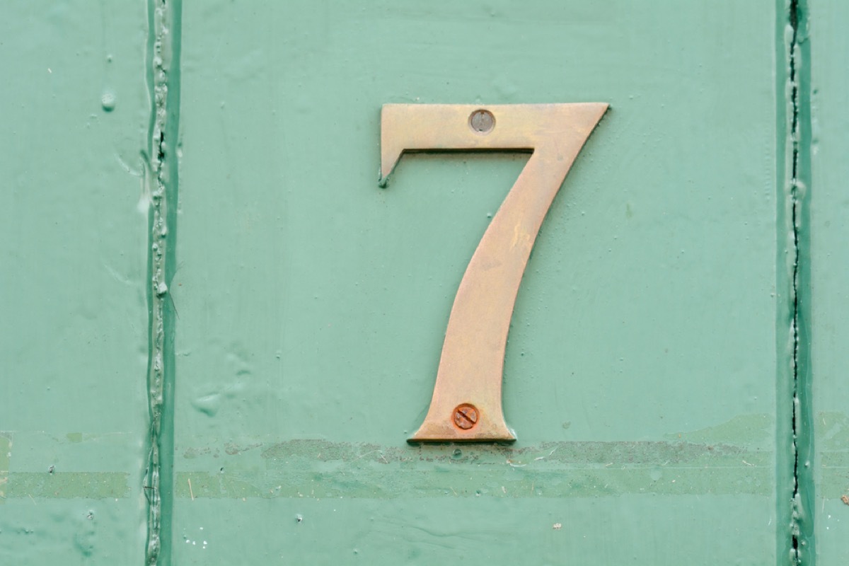 brass number seven on green door, interior design mistakes