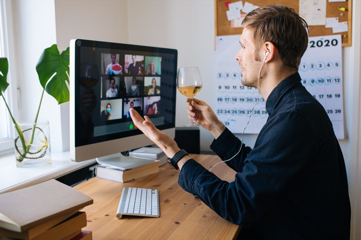 Man holding zoom happy hour with friends