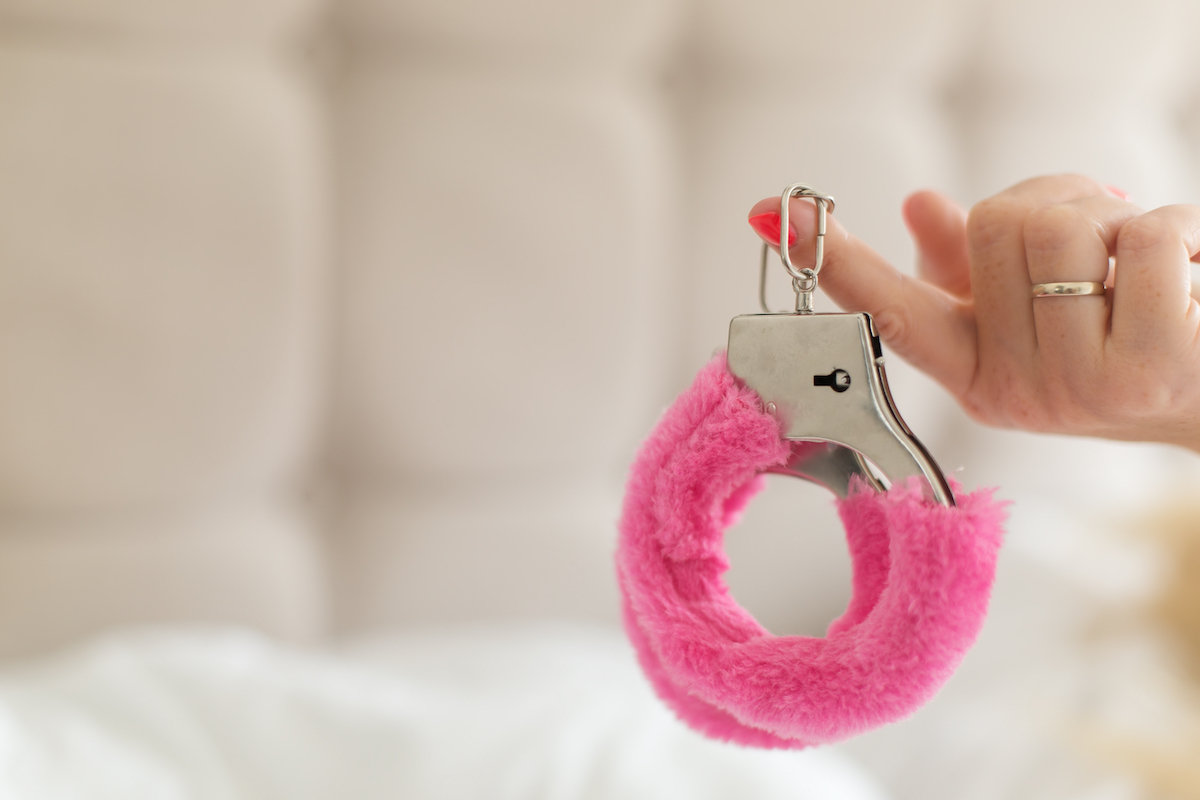 Furry pink handcuffs