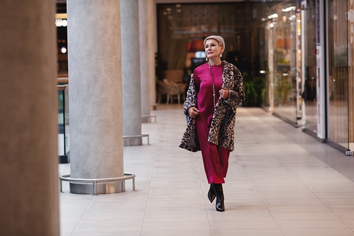 older woman wearing magenta jumpsuit