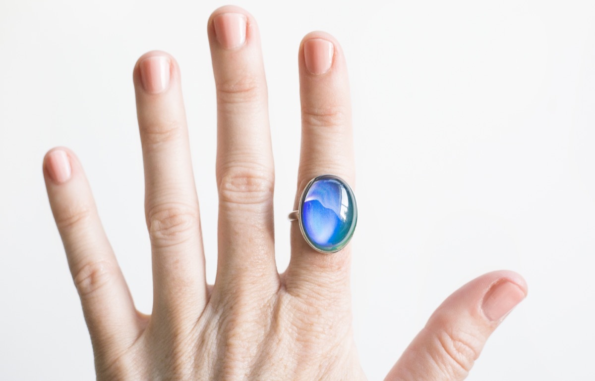 close up shot of a mood ring on a woman's hand