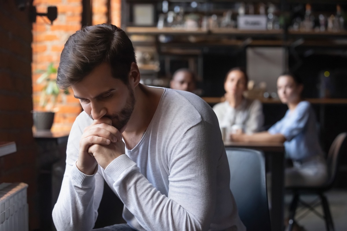 Introverted Man in Cafe