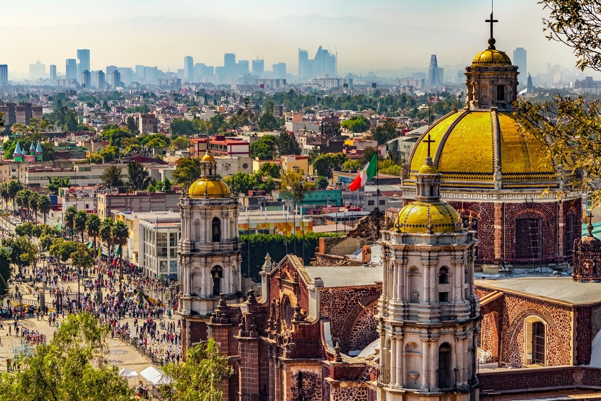 the basilica of our lady with mexico city's landscape in the background