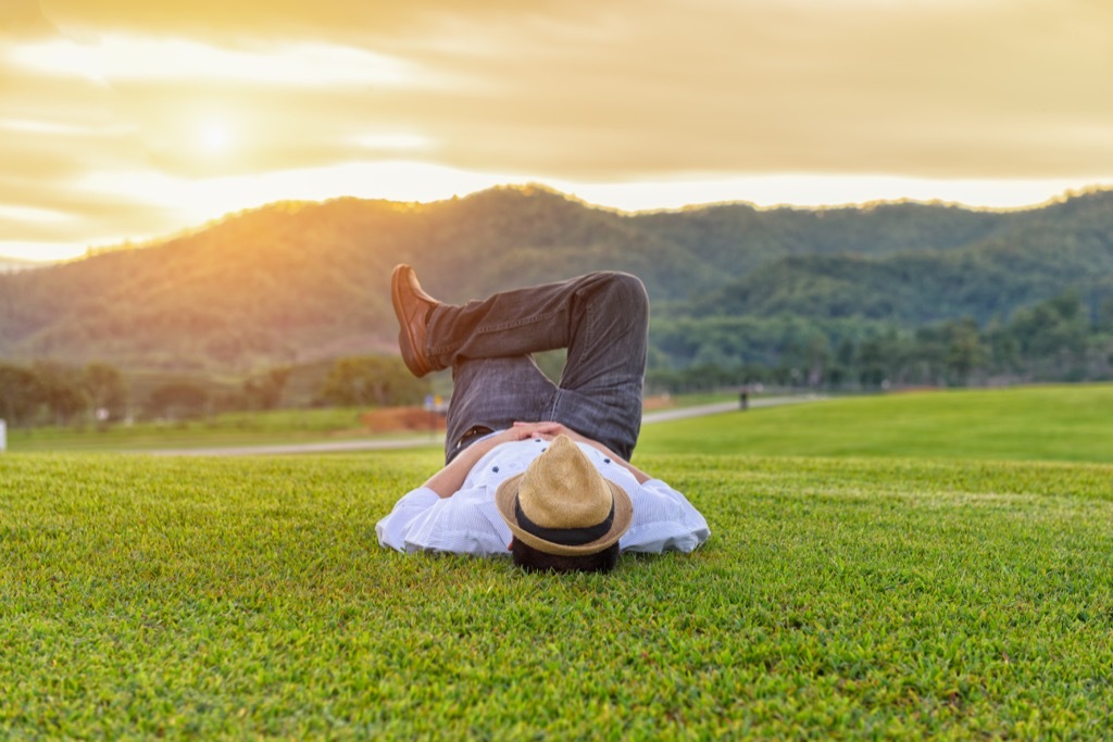 man laying on a lawn