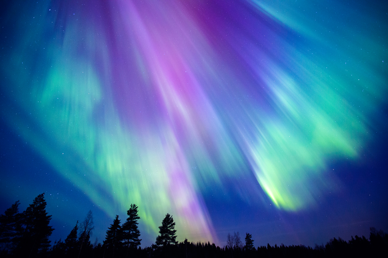 The Northern Lights in the sky with shades of green and purple