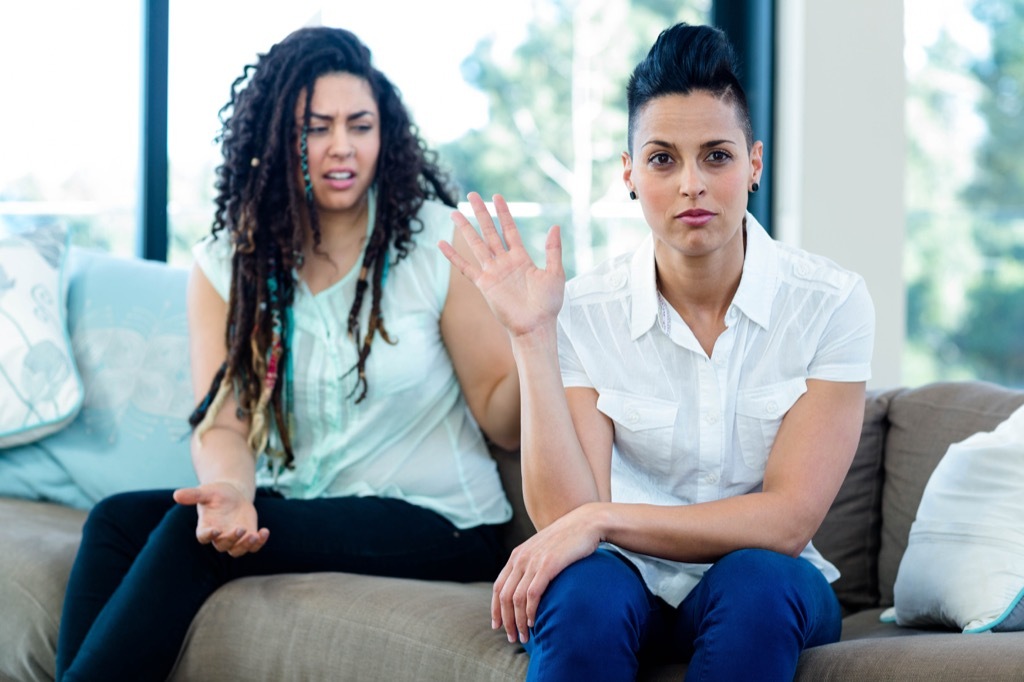 couple arguing on couch