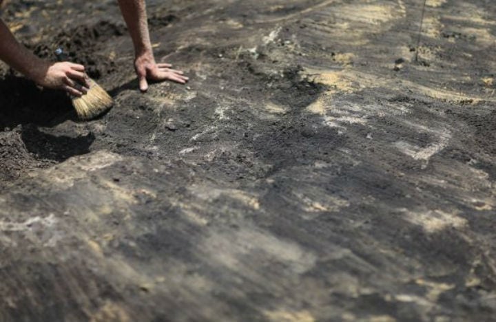 digging dig archaeological site archaeology canada triquet island british columbia