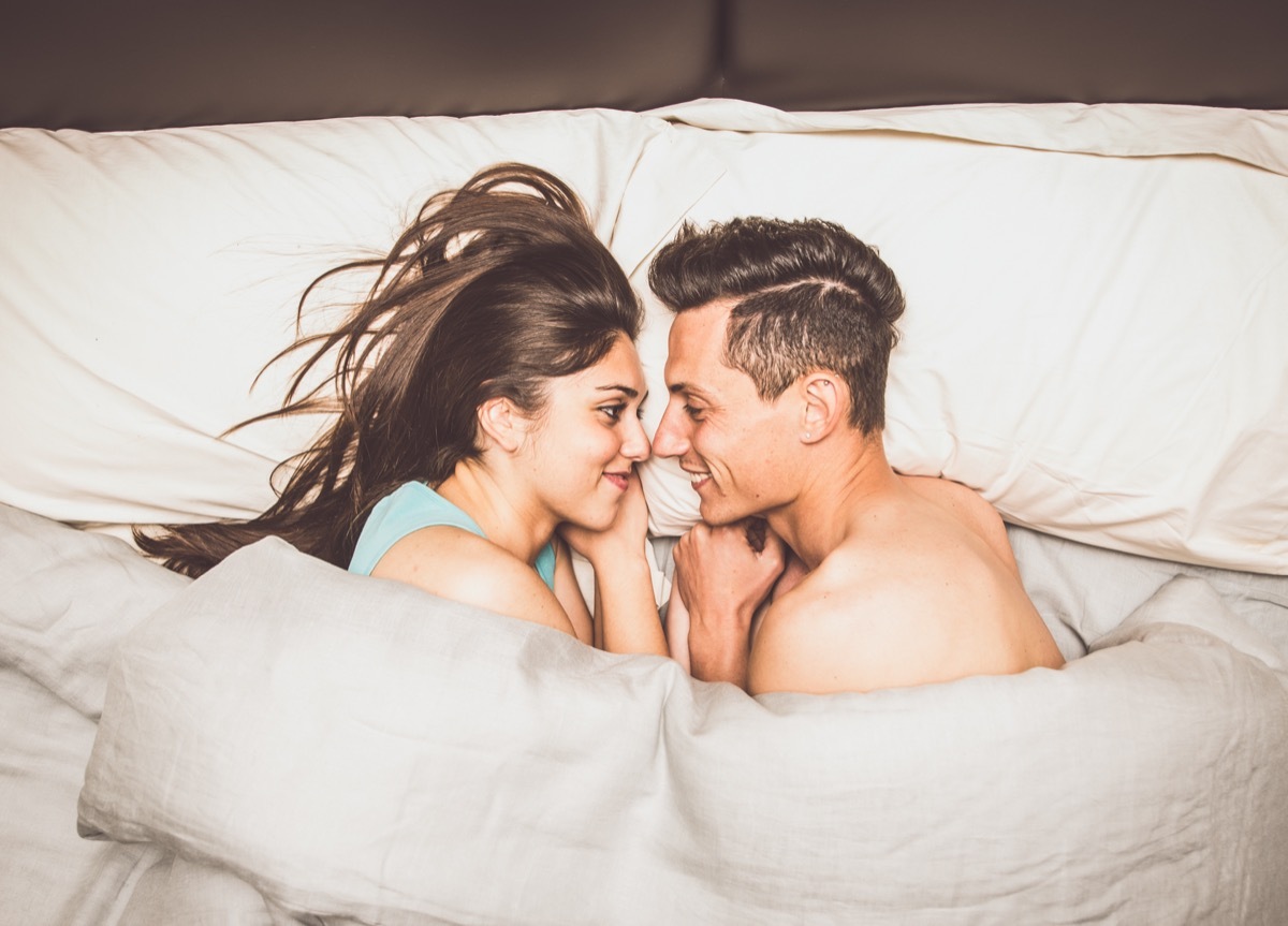 good morning text - couple smiling in bed