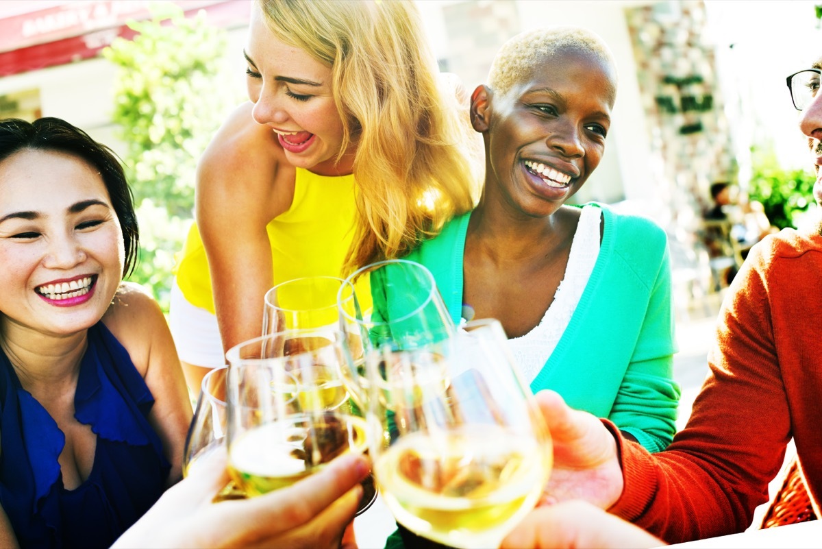 Older female friends hanging out and having some wine