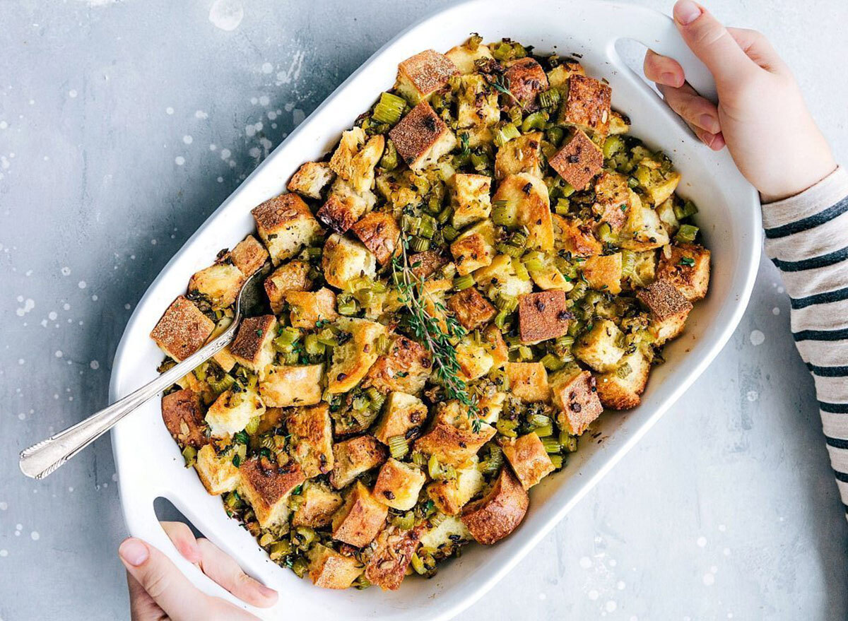 thanksgiving dressing stuffing with herbs in white baking dish