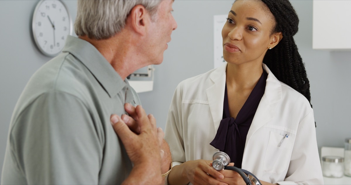 older man talking to young female doctor, school nurse secrets