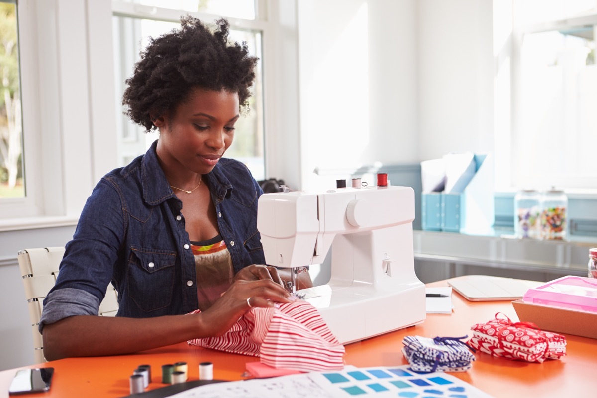 Woman sewing at home