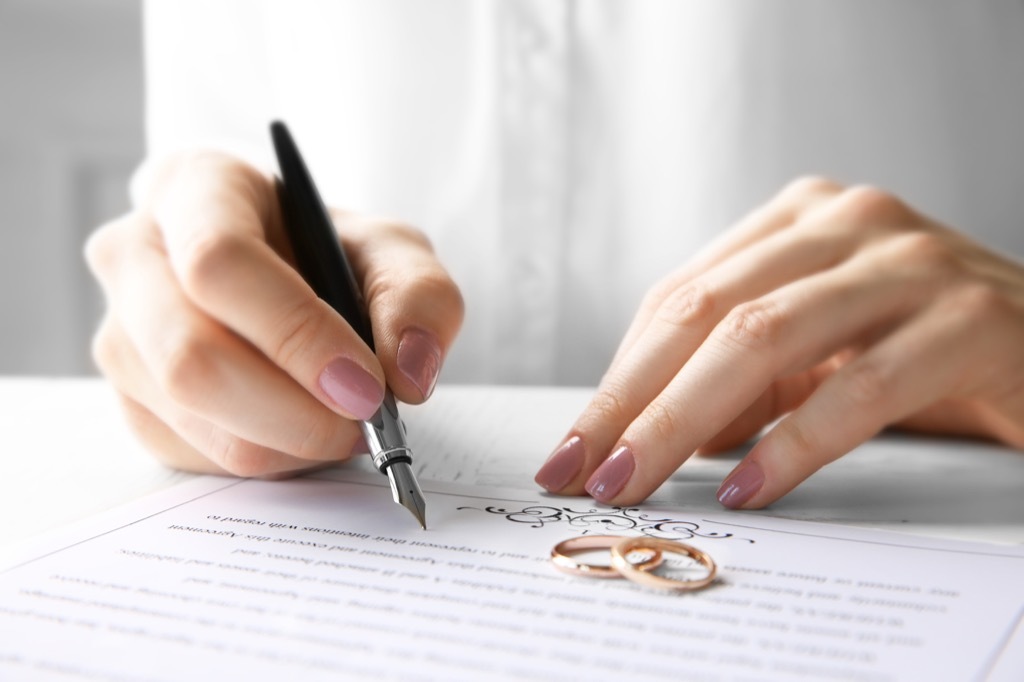 Woman signing a marriage contract, open marriage