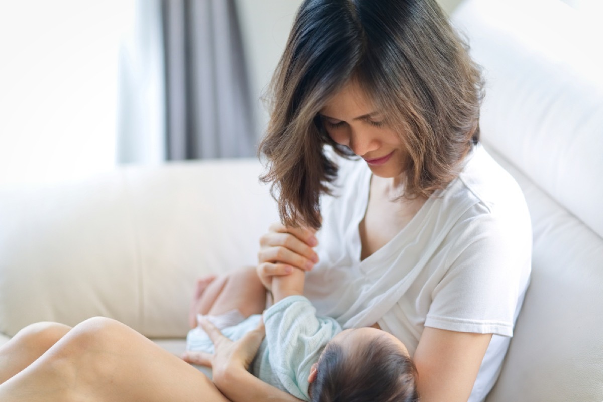 asian woman breastfeeding baby, contagious conditions